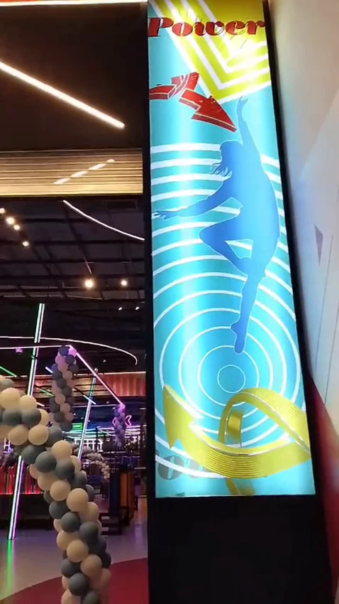 Entertainment space — Brand graphics across illuminated columns